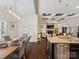 Kitchen and dining area featuring an open layout, modern lighting, and seamless transition to the living room at 237 Garvin Rd, McConnells, SC 29726