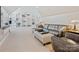 Spacious living room with a large leather sofa and custom built-in shelving at 237 Garvin Rd, McConnells, SC 29726