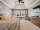 Spacious main bedroom with vaulted ceilings, fan, sitting area, plantation shutters and neutral carpet at 237 Garvin Rd, McConnells, SC 29726