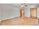 Spacious bedroom with hardwood floors, ceiling fan and double closet at 25056 Timberlake Dr, Fort Mill, SC 29708