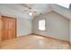 Empty bedroom with hardwood floors, window, closet, and neutral color palette at 25056 Timberlake Dr, Fort Mill, SC 29708