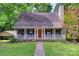 Charming home with a welcoming front porch and well-maintained lawn and mature trees at 25056 Timberlake Dr, Fort Mill, SC 29708