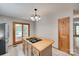 Kitchen with wooden island cooktop, tile floor, and wooden cabinets at 25056 Timberlake Dr, Fort Mill, SC 29708