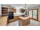 Charming kitchen with an island cooktop, wood cabinets, and stainless steel appliances at 25056 Timberlake Dr, Fort Mill, SC 29708