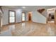 Bright living room featuring hardwood floors, large windows, and neutral paint at 25056 Timberlake Dr, Fort Mill, SC 29708
