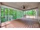Spacious screened porch offering a relaxing outdoor space with wooded views at 25056 Timberlake Dr, Fort Mill, SC 29708