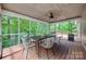 Relaxing screened porch with a large table and chairs, perfect for outdoor dining at 25056 Timberlake Dr, Fort Mill, SC 29708