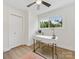 Bright bedroom features a modern ceiling fan and a window view of the outdoors at 2600 Alleghany St # 10, Charlotte, NC 28208