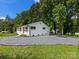 Charming home features a well-manicured front yard and a gravel drive at 2600 Alleghany St # 10, Charlotte, NC 28208