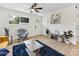 Bright living room with a yellow sofa, a dark blue rug, and hardwood floors at 2600 Alleghany St # 10, Charlotte, NC 28208
