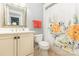 Bathroom with a vanity, floral shower curtain, and modern fixtures at 3068 Green Acres Ln, Claremont, NC 28610