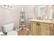 This powder room shows a decorative shelf, tiling, and an ornate mirror above the vanity at 3068 Green Acres Ln, Claremont, NC 28610