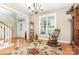 Inviting foyer with hardwood floors, elegant chandelier, and staircase to the second level at 3068 Green Acres Ln, Claremont, NC 28610