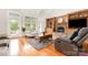Bright living room features vaulted ceilings, fireplace, hardwood floors and direct access to the deck at 3068 Green Acres Ln, Claremont, NC 28610