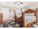 The main bedroom offers a decorative bed frame, hardwood floors, and light-filled windows at 3068 Green Acres Ln, Claremont, NC 28610