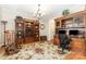 Spacious office features built-in bookshelves, a work space, and hardwood floors at 3068 Green Acres Ln, Claremont, NC 28610