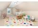 Bright playroom with colorful rug and an organized shelving unit for toys at 3068 Green Acres Ln, Claremont, NC 28610