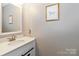Stylish half bath features a modern sink, attractive picture, and neutral paint palette at 3092 Hitching Post Ln, Rock Hill, SC 29732