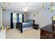 Fun bedroom with space themed decorations, a ceiling fan, and carpeted flooring at 3092 Hitching Post Ln, Rock Hill, SC 29732
