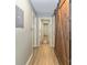 Inviting hallway with hardwood floors, neutral paint, and a sliding barn door adds character at 3092 Hitching Post Ln, Rock Hill, SC 29732