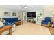 Comfortable living room features a ceiling fan and large windows for natural light at 3092 Hitching Post Ln, Rock Hill, SC 29732