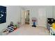 playroom featuring a play kitchen, a small basketball hoop and a large door at 3092 Hitching Post Ln, Rock Hill, SC 29732