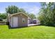Back exterior featuring a wooden deck and green grass at 322 Cottonwood Park Dr, Charlotte, NC 28214