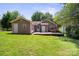 Back exterior featuring a wooden deck and green grass at 322 Cottonwood Park Dr, Charlotte, NC 28214
