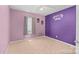 Spacious bedroom with neutral carpet, a ceiling fan, and 'Pappy's Gym' wall art at 322 Cottonwood Park Dr, Charlotte, NC 28214