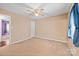 Neutral bedroom featuring a ceiling fan, carpet flooring, and window with curtain at 322 Cottonwood Park Dr, Charlotte, NC 28214