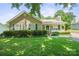 Charming single-story home with well-manicured lawn and cozy front porch with white picket fence at 322 Cottonwood Park Dr, Charlotte, NC 28214
