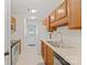 Traditional kitchen featuring wood cabinetry, stainless steel appliances, and a double basin sink at 322 Cottonwood Park Dr, Charlotte, NC 28214