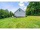 Side view of home with satellite dishes and central air, set against lush foliage at 3659 Vashti Rd, Taylorsville, NC 28681