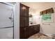 Bathroom featuring a double sink vanity with dark cabinets and a shower at 3659 Vashti Rd, Taylorsville, NC 28681