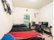 Bedroom with a black bed, gaming desk and chair, and light from window at 3659 Vashti Rd, Taylorsville, NC 28681