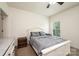 A bright bedroom featuring a white bed frame, a window, and a ceiling fan at 3659 Vashti Rd, Taylorsville, NC 28681