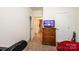 Bedroom with access to closet and bathroom features a TV, dresser, and neutral carpet at 3659 Vashti Rd, Taylorsville, NC 28681