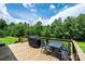 Large wooden deck features outdoor seating and grilling, perfect for outdoor entertaining at 3659 Vashti Rd, Taylorsville, NC 28681
