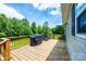 Spacious wooden deck, perfect for entertaining or enjoying outdoor dining with grill at 3659 Vashti Rd, Taylorsville, NC 28681