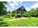 A well-kept lawn leads up to a cozy home with a charming, covered porch at 3659 Vashti Rd, Taylorsville, NC 28681
