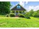 A charming home featuring a welcoming front porch and beautifully landscaped yard at 3659 Vashti Rd, Taylorsville, NC 28681