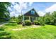 Charming two-story home with a covered porch and lush green lawn, perfect for outdoor living at 3659 Vashti Rd, Taylorsville, NC 28681