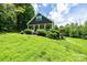 A well-manicured lawn surrounds this home, complete with a cozy front porch at 3659 Vashti Rd, Taylorsville, NC 28681