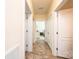 Hallway with tile flooring leading to various rooms, including a bedroom at 3659 Vashti Rd, Taylorsville, NC 28681