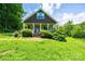 Single-Gathering home with a quaint porch framed by manicured bushes at 3659 Vashti Rd, Taylorsville, NC 28681