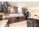Kitchen area featuring dark wood cabinets, stainless steel appliances and large central island at 3659 Vashti Rd, Taylorsville, NC 28681