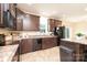 Modern kitchen with dark cabinets, granite counters, stainless appliances, and a view into the dining area at 3659 Vashti Rd, Taylorsville, NC 28681