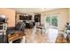 Open concept kitchen with modern appliances, dark cabinetry, dining area, and living space at 3659 Vashti Rd, Taylorsville, NC 28681