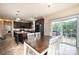 Eat-in kitchen with stainless steel appliances, dark cabinetry, and a sliding glass door to the patio at 3659 Vashti Rd, Taylorsville, NC 28681