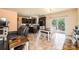 Open concept living room and kitchen area with tile flooring and sliding glass door to outdoor deck at 3659 Vashti Rd, Taylorsville, NC 28681